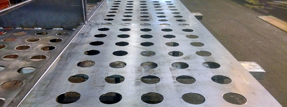 Fabricated_Steel_Sheet_holes - Sheet_Steel_Fabricators_in_NYC - Flat_Sheet_Fabricated_to_exact_specifications_NYC